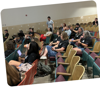 Teachers learning in an auditorium